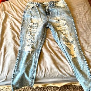 Selling blue jeans with rips in them that’s how they are made